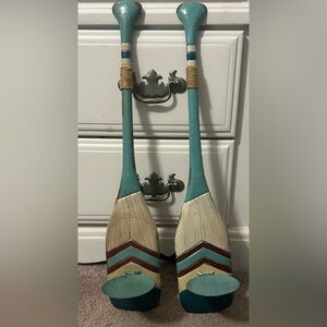 Two metal decorative boat oar candle holders.  24” length 4” Wide Beach Decor